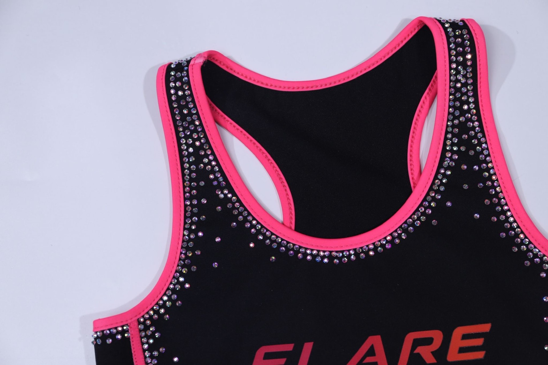 Hand-set rhinestone FLARE logo detail